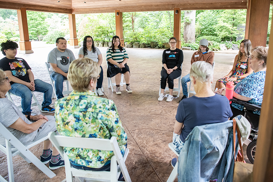 People grieving loved ones sitting together in nature at Anderson Japanese Gardens in Rockford discussing loss and growth during Tranquil Tuesday, a weekly bereavement event hosted by Northern Illinois Hospice. - June 17, June 24, July 1, July 8, July 15, July 22, July 29, August 5, August 12, August 19, August 26, September 2